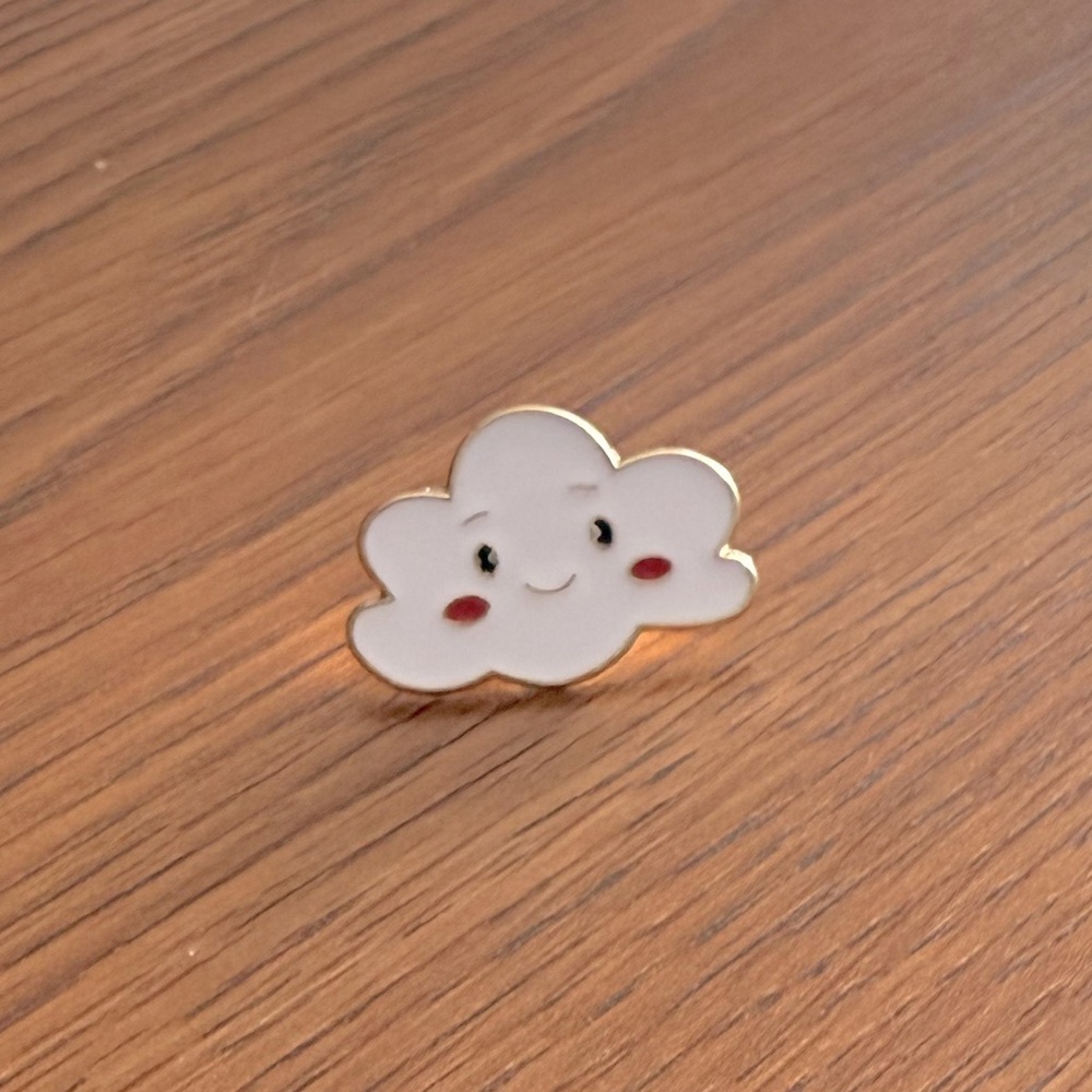 Women’s Jewelry Smiling White Cloud Enamel Pin with hints of Black, Gold & Red